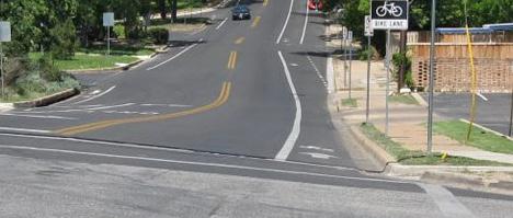 from vehicle travel lanes by striping, and can include pavement stencils and other treatments.