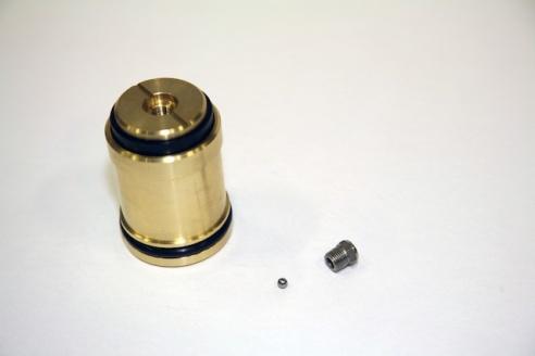 Remove the filter nut 7/16-inch from the bottom of