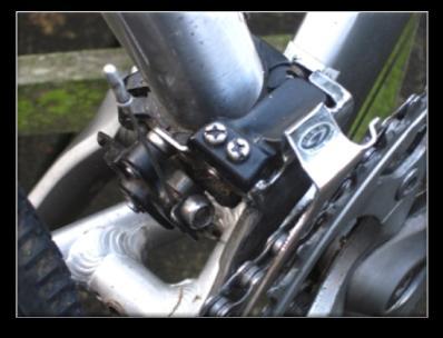 To adjust the derailleur height and angle simply loosen slightly the bolt holding the clamp in place using your Allen key.