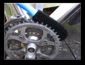 Use a wet brush to clean the rear sprockets and derailleur. Again use degreaser if particularly mucky.
