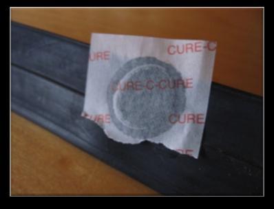 Use the abrasive paper that came with your puncture repair kit to scrape