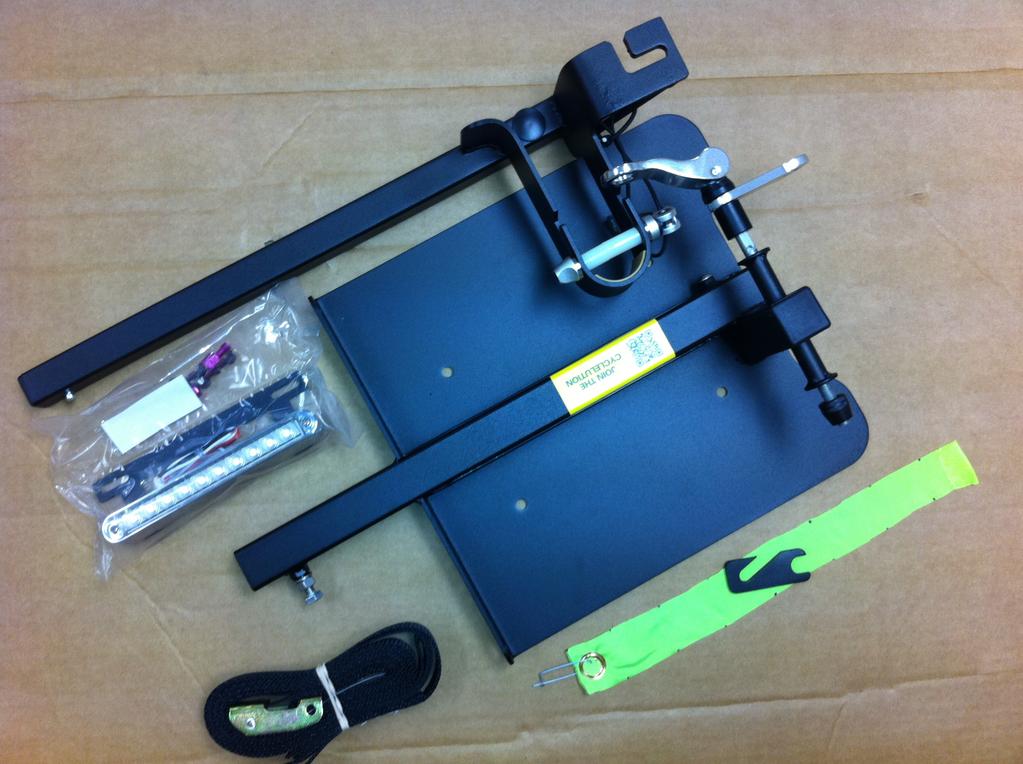 What s in the Box: Base plate Adjustable telescoping arm Large front fork quick release Small pedal trap quick release Load Distribution Strap (LDS) S.H.O.