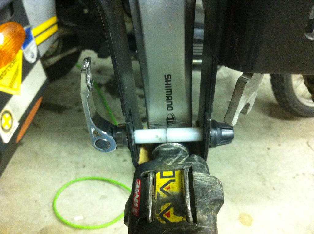 3 Now go ahead and put the small pedal quick release in. Lower it down to the pedal and tighten. 4 Using your S.H.O.