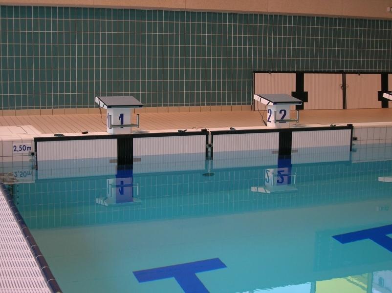The starter will blow three short whistles; this informs the swimmers to come to blocks but not to step on the blocks at this point.