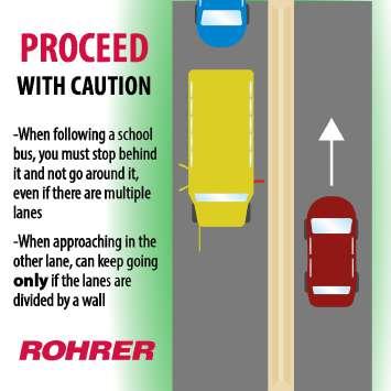 stopped school bus on a road with ridged or grooved dividers.