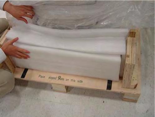 Assembly Installation Guide FIGURE 2-10 12. Remove the foam packing material from around the back of the unit.