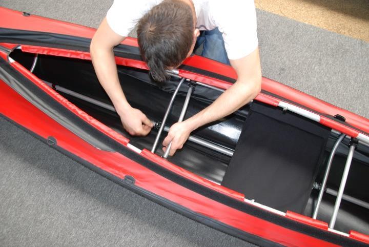 It might help to slightly press the two stringer elements inside the boat, in order to place