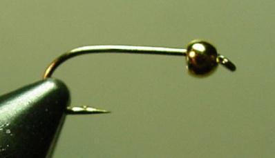 Step - By - Step Tying Instructions Bead Head Prince Nymph 1. Bend the barb of the hook down, slide a bead onto the hook shank, and mount the hook in the vise (Fig. #1.