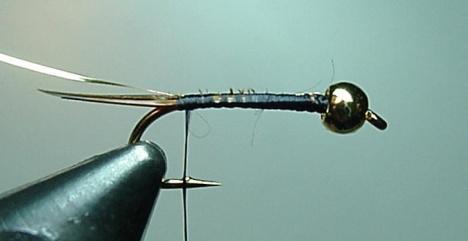 You may want to form a small thread bump at the position on the shank over the hook barb. This is the tiein position for the biot tails.