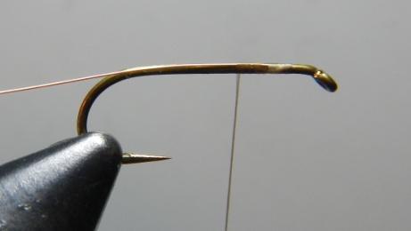 Step-By-Step Tying Instructions for the Troth Elk Hair Caddis 1. Bend the barb down on the hook and mount the hook in the vise. Attach thread with a jam knot about one eye length behind eye of hook.