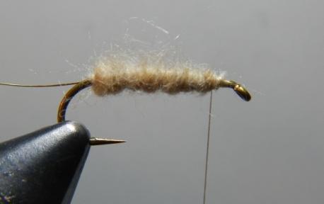 Select and prepare the dry fly hackle by stripping off the fluff. Al Troth preferred the barb length to be 1½ the gap width.