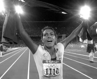 Athletics World Championship, 1999, Sevilla, Spain Carrying both flags during a victory lap at the 2000 Olympic Games in Sydney Olympic Fame The years 1998 and 1999 brought Cathy even more success.