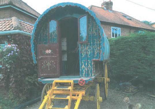 To be sold with a two-wheeled trailer in good working order, painted red and with ramps 35 BARREL TOP GYPSY WAGON circa 1900; painted blue with red/yellow/green decoration to the body and a yellow