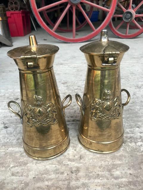 1283 33ins high iron delivery churn with brass tap and vent on lid 1284 10ins high carrying milk churn with brass hinge 1285 Pair of 8ins high brass tapering cylindrical milk churns believed to be