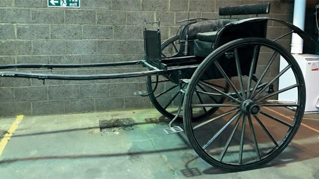 24 BUTCHER S CART to suit 15 hh; a panelled body painted dark brown and decorated and sign written in yellow lettering