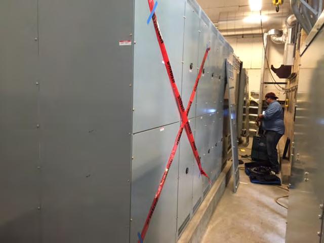 Figure 5B Unit Substation during Maintenance, Rear Using barricade tape on both the front and back of the energized