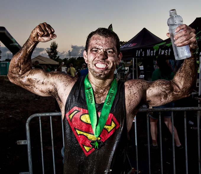 Whichever run you choose, you re in for a good time! Children sometimes have so much fun on these courses that they run them two or three times. A man is happy after finishing a mud run.