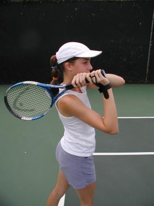 two-hander. For example, if you play right-handed, your left hand would become the dominant hand for the two-handed topspin groundstroke.