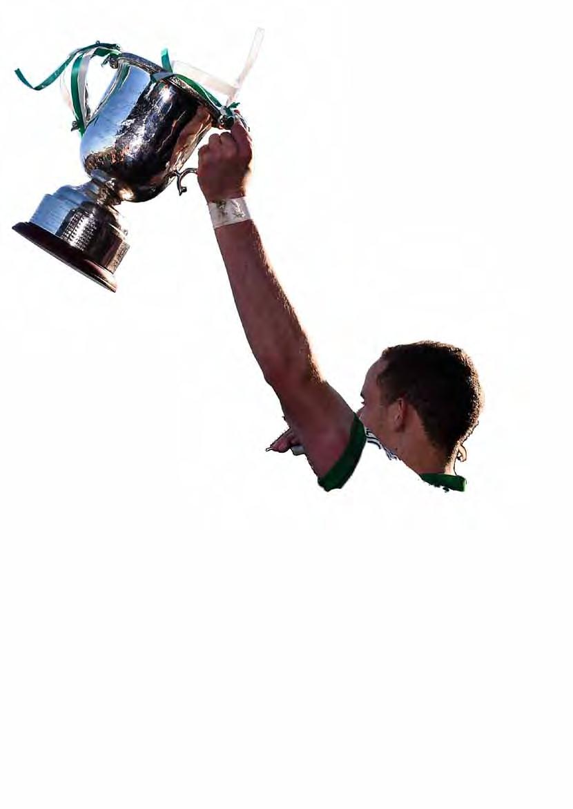 Kennedy lifts the cup after the Wicklow