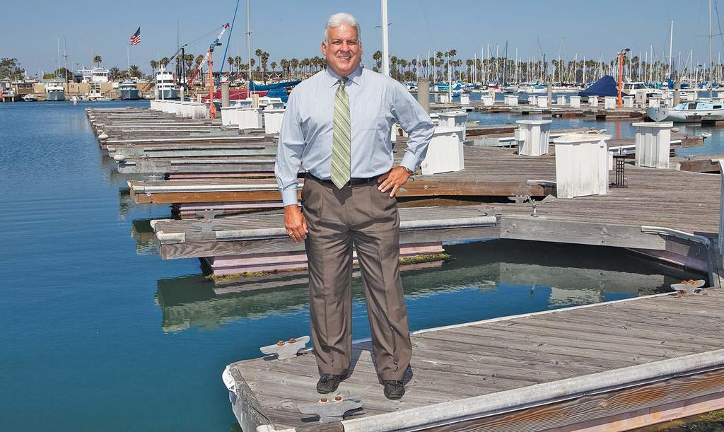 Mark Sandoval, general manager of the Long Beach Marine Bureau, stands on a slip finger at Alamitos Bay Marina s basin 4, where work is expected to start this year as part of the marina rebuild