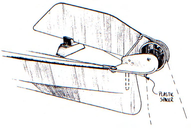 Finally, fit a retaining screw just forward of the black plastic disk that protrudes from the front of the rudder head (Figure 3).