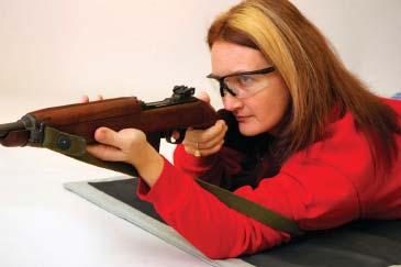 FIRING POSITION--USING A HASTY SLING The standard sling for the M1 Carbine is a simple strap that was intended primarily as a carrying sling, but which also can be effectively used to build a