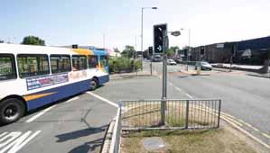 gives access to a bus-only road across a large, busy roundabout resulting in bus