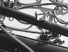 One end is labeled starboard (right) and the other port (left). There is a hole in each end of the tiller crossbar and a pin on swivel on each rudder (tiller) arm.