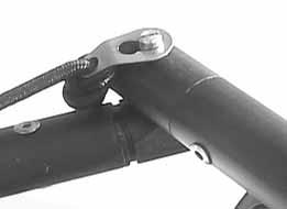 Capture the tiller arm to the tiller crossbar with the keyhole retainer clip on the tiller arm. Be sure that the tiller extension hinge is on top.