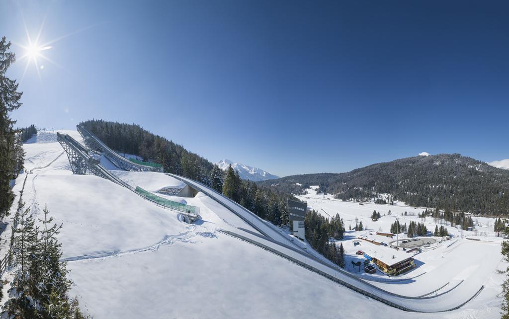 in the very center of winter sports activities, with views of the imposing ski jump and stadium arena, as well as the entrance to the cross-country ski trails.