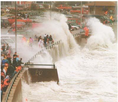 Figure 7-3. Illustration of wave overtopping of a sloped structure. Overtopping occurs when the runup exceeds the crest of the structure (USACE, 2006). Figure 7-4.