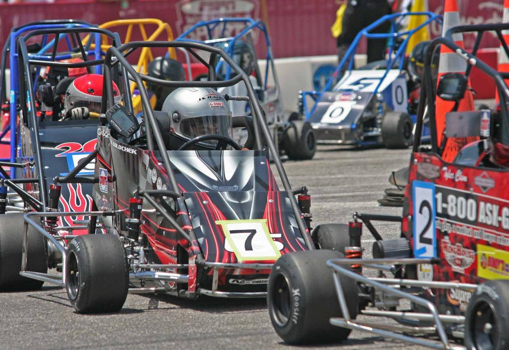 Isaak Solochek (#7) is flanked by Tyler Clem, front, and Chandler Smith at USAC s Mopar.
