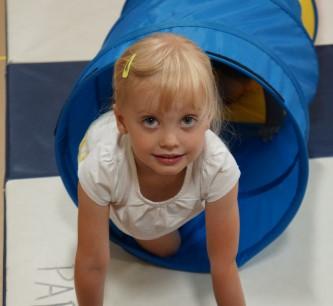 Enjoy ball play, tunnel time, parachute games, dancing, action songs, and movement activities.