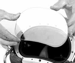 3) Place the face port into the helmet shell making sure the O-ring has been lightly lubricated and is in its groove. Place the new face port into the helmet shell.