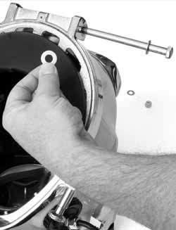 Take care not to lose the two Teflon washers that sit between the locking collar and the rear hinge mounts on the helmet ring.