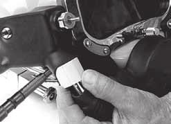 Tighten with a flat blade screwdriver until the valve stem is flush with the lock nut face.