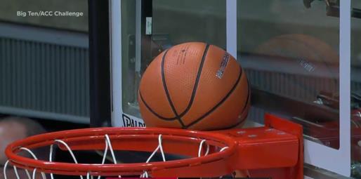 Ball lodged between backboard and ring Ball is now deemed to have touched the ring.