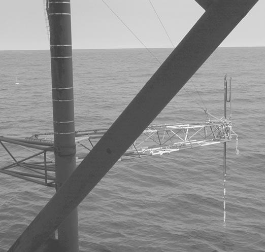 Schematic representation of the wave follower (WF) attached to the outrigger at Meetpost Noordwijk. Figure 2. Photograph of the wave follower in action.