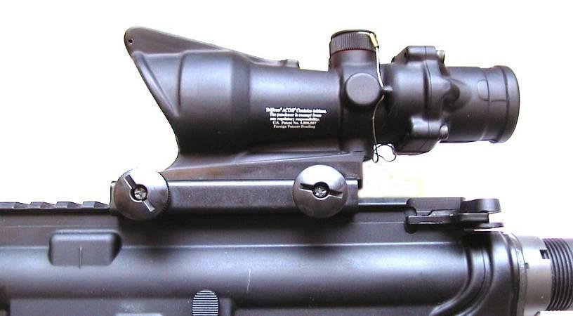 Installation: Rail MOUNTING The AN/PVQ-31A(RCO) can be placed in any of the slots on top of the receiver to allow