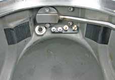 Use a 15/16" deep socket and foot pound torque wrench to tighten the comms bulkhead (26) to