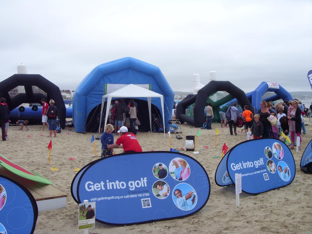 OVER 5,000 PEOPLE TRIED GOLF AT OLYMPICS Be Active Truro Week Over 5,000 people were introduced to golf at the Olympics Live Sports Arena on Weymouth beach in the start of August.