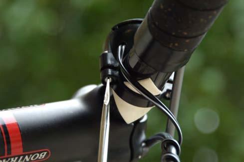 14. Attach the ibike Pro to the handlebar mount by setting it on the handlebar mount as shown below (as you sit on