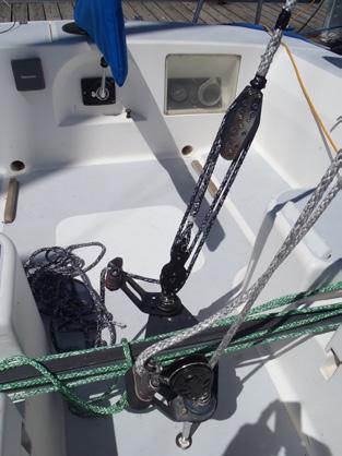 Part 1 Rigging Preparation (Continued) Move mainsheet swivel base forward of the traveler This allows for easier trim of the gross tune by the main trimmer, especially when tacking.