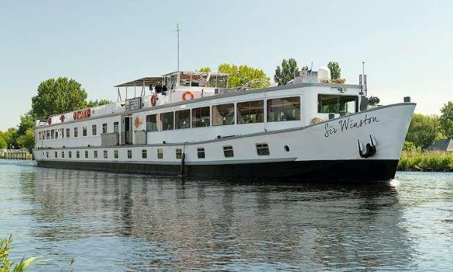 The cruise ship MS Sir Winston A cozy river boat with a restaurant and bar.