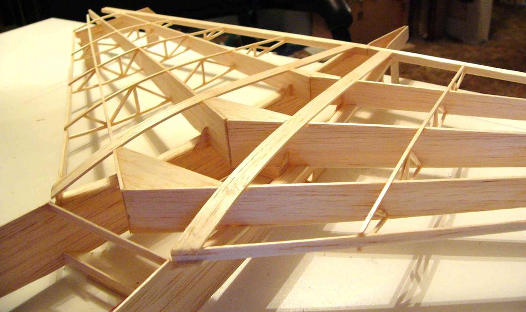 5mm square balsa into the notches on the spars, butting up against the trailing edge, and resting on the leading edge.