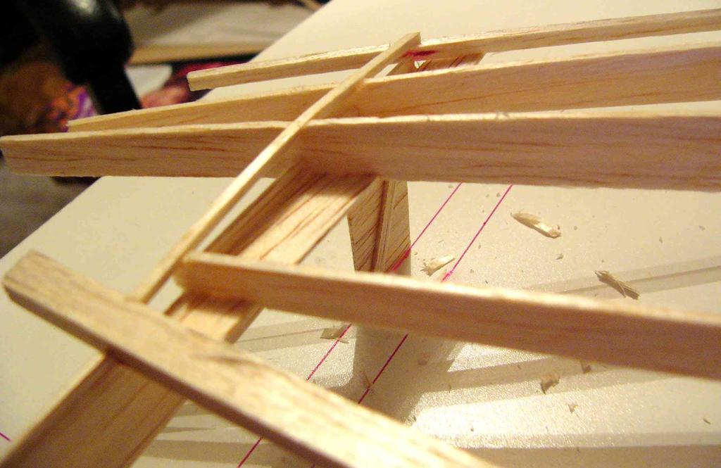 Now make sure that the pieces are seated properly in the spars, and finish by gluing to the spars. Do this for all the ribs.