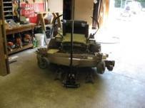 o Worker used a hydraulic floor jack to raise mower deck during maintenance and