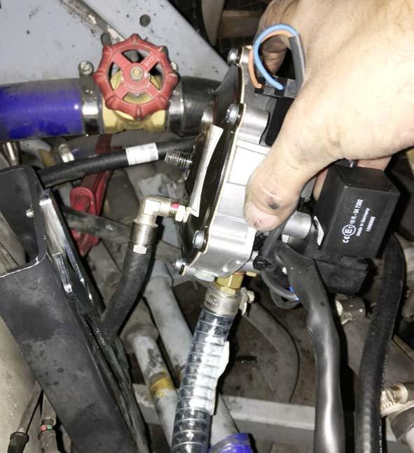 Establish gas pressure regulator connections Secure hose onto