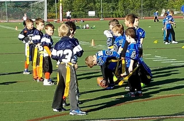 ! Bottom-Right The O lines up against Milford 10U Defense Stands Tough By Bickford Wallington Jr.