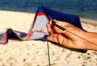 SETTING UP YOUR KITE Inflate your kite Unroll your kite and position it so that one of its wing tips is located upwind from the other.